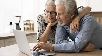 Male and Femal patients looking at a computer.