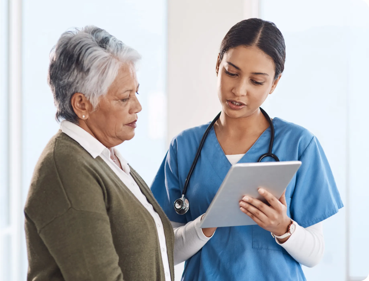 Female doctor conversing with a female patient.