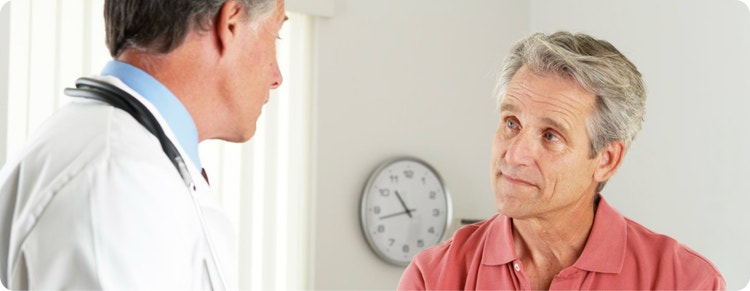 Doctor conversing with a patient.