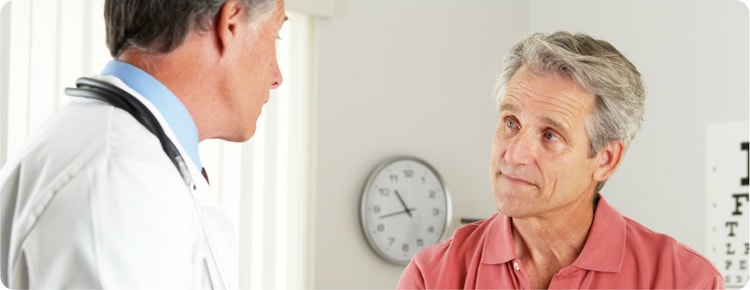 Doctor conversing with a patient.